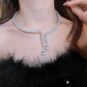 Close-up of luxury silver-tone fringe necklace with drop zircon pendants and crystals