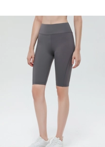 Close-up of high-waisted dark grey cycling shorts with ergonomic side seams and stretch fit