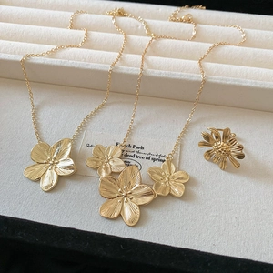Vintage gold flower pendant necklace and ring set with fine brushed texture finish