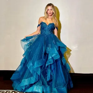 Peacock blue off-shoulder evening gown with floral sequins and layered tulle skirt