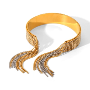 Detail of bicolor gold and silver steel bangle with tassel bead chains and metal finish