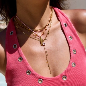Layered gold chain necklace set with pink beads and a detailed gold fish pendant for women