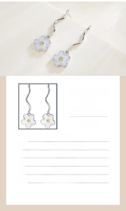 Detailed view of S925 sterling silver daisy earrings with 7mm by 21mm dimensions
