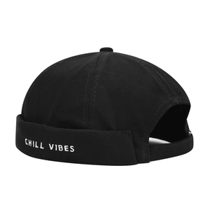 Black cotton docker hat with white Chill Vibes embroidery for a minimalist streetwear look