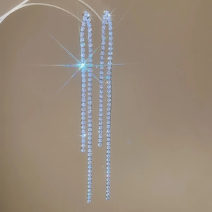 Detailed view of silver multi-layer long fringe tassel earrings with sparkling crystals