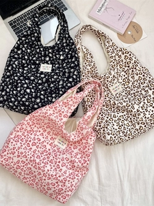 Three Korean-style canvas tote bags in black, pink, and beige with heart leopard prints