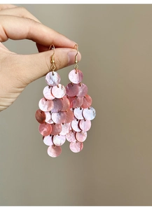 Detail of pink shell petals on tiered tassel earrings with gold-toned metal hooks