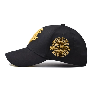 Black cotton baseball cap featuring gold embroidery and street style WOLF badge design