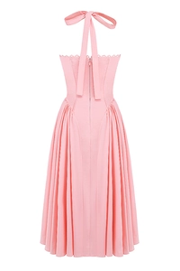 Detail view of the pink halter dress back featuring a zipper closure and pleated fabric