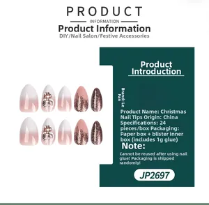 Detailed view of pink gradient Christmas false nails with 3D pearls and glitter accents