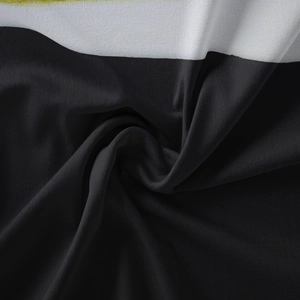 Macro shot showing silky texture and black and white contrast of the polyester tapestry
