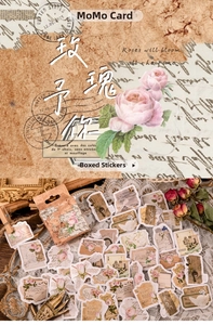 Detail of vintage rose stickers on white lace with newspaper and musical notes