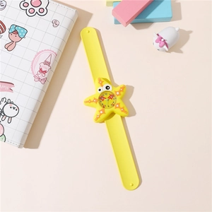 Detail of yellow starfish cartoon slap watch for kids with soft silicone strap and clear dial