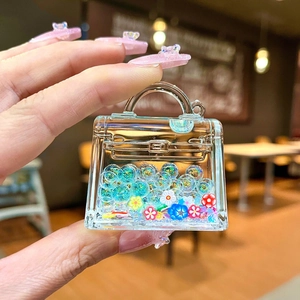 Luminous acrylic handbag keychain with floating colorful glitter beads and flower charms