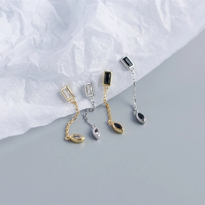 Detailed macro view of S925 sterling silver chain tassel earrings with marquise cut stones