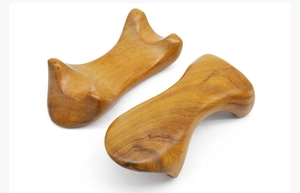 Pair of polished Vietnamese fragrant sandalwood gua sha massage tools with natural grain