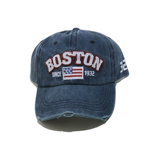 Detailed view of the vintage washed denim cap with embroidered BOSTON lettering and distressed brim