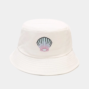 Close-up of shell embroidery detail on white canvas bucket hat with neat stitching