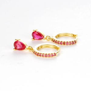 Elegant gold drop earrings with pear-cut red crystals and sparkling zircon accents
