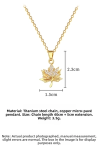 Detailed view of gold maple leaf pendant with pavé cubic zirconia and 45cm chain