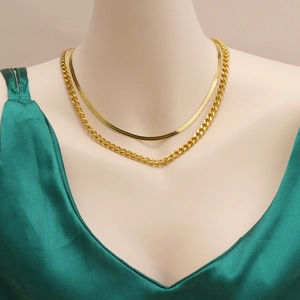 Double-layered 18K gold plated Cuban and snake chain necklace on a female model mannequin
