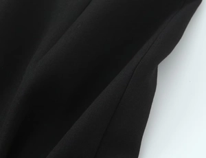 Macro view of black high-quality plain weave fabric with fine textile texture and drape