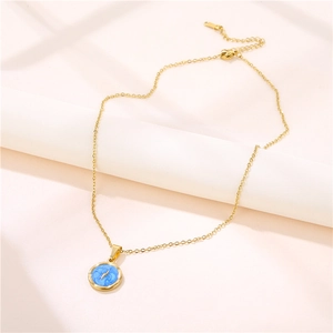 Golden stainless steel round pendant necklace with blue enamel and lightning bolt design