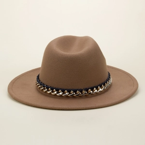 Close-up of camel wool fedora hat featuring a navy braided band and gold chain detail