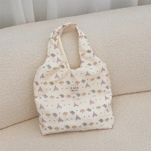 Detail of cartoon elephant embossed canvas tote bag with textured bubble fabric texture