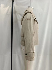 Side view detail of a khaki hooded short windbreaker jacket with cuff strap design