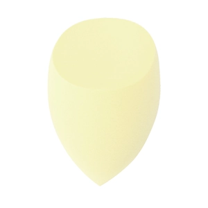 Detail view of the soft yellow non-latex makeup sponge with an angled flat-cut design