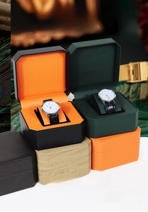 Detail of octagonal PU leather watch boxes in multiple colors with soft velvet interior