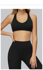 Detail of high-stretch brushed yoga sports bra with deep V-neck and racerback in black