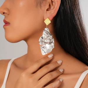 Modern irregular leaf geometric square earrings in two-tone gold and silver on model