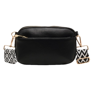 Minimalist black pebbled leather crossbody bag with patterned woven wide shoulder strap