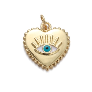 Detailed close-up of golden heart pendant with evil eye motif and beaded edge detailing
