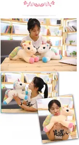 Detail of plush rainbow unicorn doll with soft faux fur texture and colorful wings