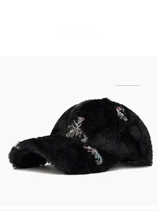 Close-up of black faux fur baseball cap with detailed colorful floral embroidery pattern