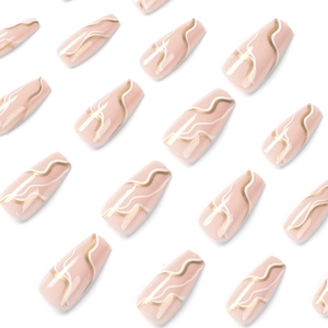 Minimalist white and gold wavy press-on nails in nude pink color with coffin shape