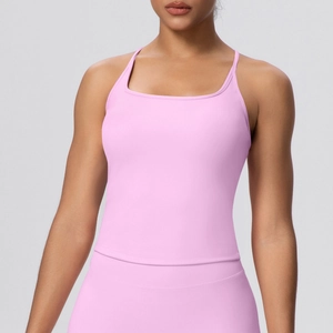 Close-up of pink yoga tank top with thin straps and elastic moisture-wicking fabric