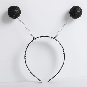 Detail of black alien headband with glitter antenna balls and metal springs for parties