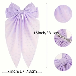 Purple polka dot bow hair clip with long tails and textured chiffon fabric details