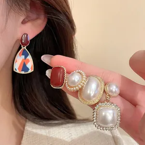 Vintage gold earrings with pearls, colorful resin accents and sparkling zircon crystals