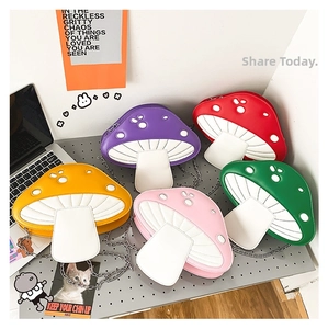 Detailed view of colorful mushroom shaped crossbody bags with metal chains in five colors