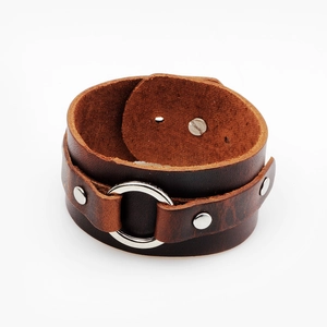 Handcrafted brown leather wide cuff bracelet featuring silver metal ring and rivets