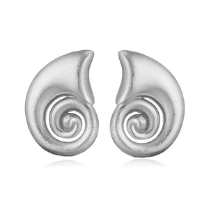 Macro view of silver ocean-themed conch shell stud earrings with matte metal texture