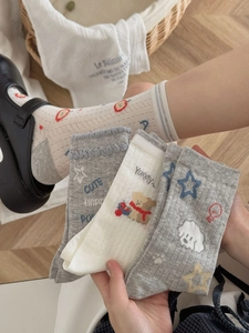 Detailed knit texture of breathable mesh cotton socks with cute cartoon puppy pattern