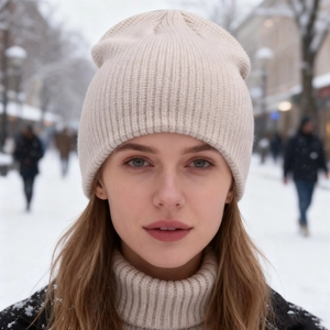 Warm beige knitted beanie hat for winter outdoor protection with premium ribbed texture
