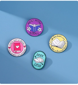 Set of four colorful enamel lapel pins with inspirational reading and book club quotes
