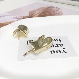 Elegant gold U-shaped metal hair clip with a smooth mirror finish for a minimalist look